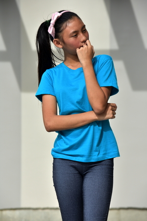 Youthful Minority Teen Girl Thinkingの写真素材