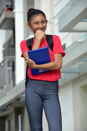 Youthful Asian Female Student And Happinessの写真素材