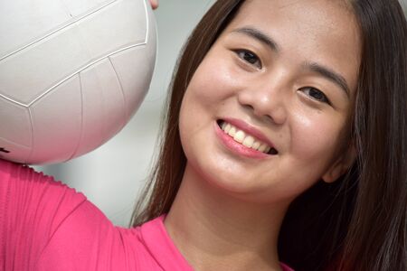 Happy Female Athlete With Volleyballの写真素材