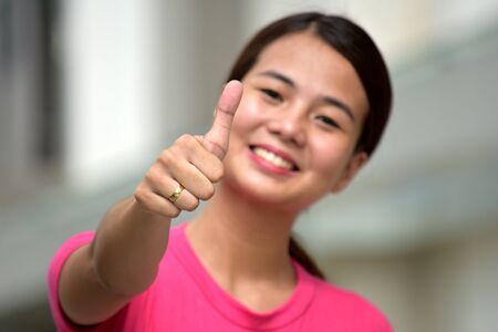 Female With Thumbs Upの写真素材