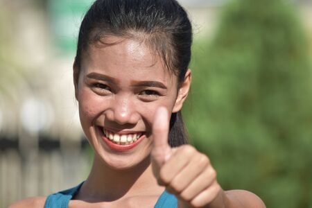 Woman With Thumbs Upの写真素材