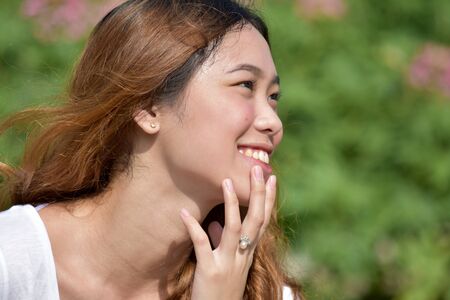 Contemplative Youthful Filipina Womanの写真素材