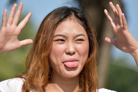Young Filipina Female Making Funny Faces