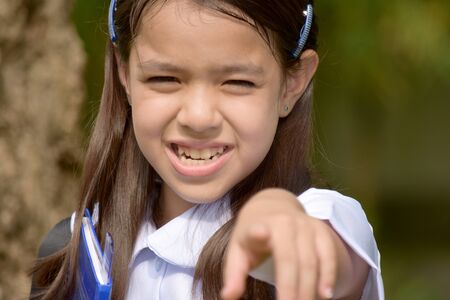 Girl Student Pointing With Notebooksの写真素材