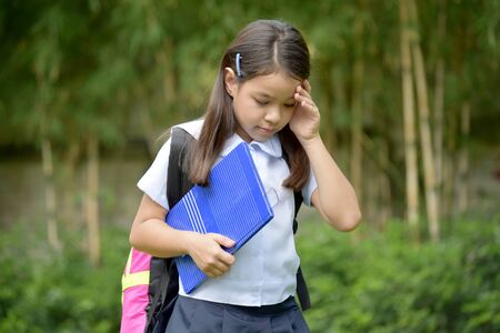 Depressed Girl Student Wearing Uniformの写真素材