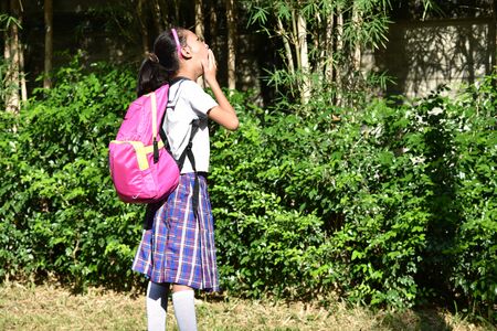 Surprised Prep Asian Female Student With Notebooksの写真素材