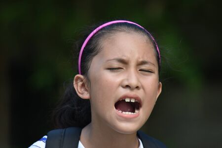 Shouting Minority School Girl Student Teenager With Booksの写真素材