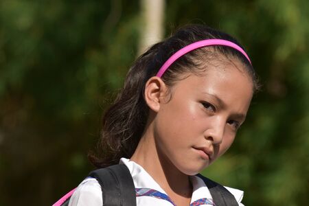 An Unemotional Female Student With Notebooksの写真素材