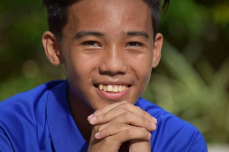 A Praying Young Filipino Boy