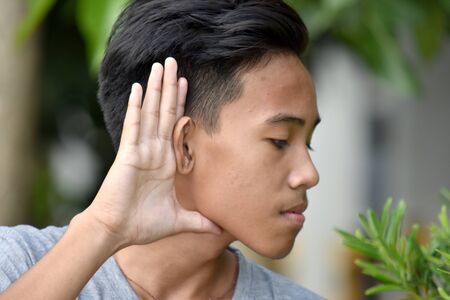 A Youthful Minority Male Listening
