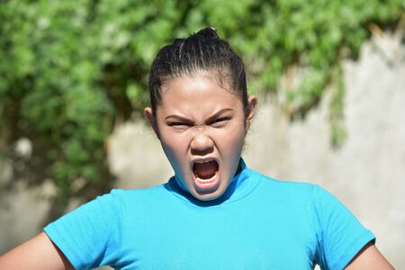A Pretty Asian Woman Yellingの写真素材