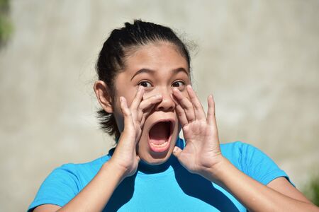 A Youthful Asian Female Shoutingの写真素材