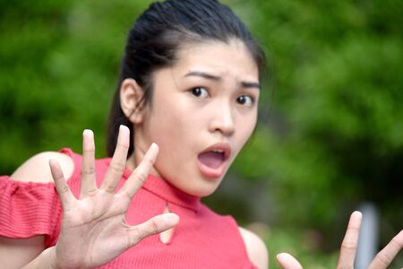 A Pretty Female Youngster Afraidの写真素材