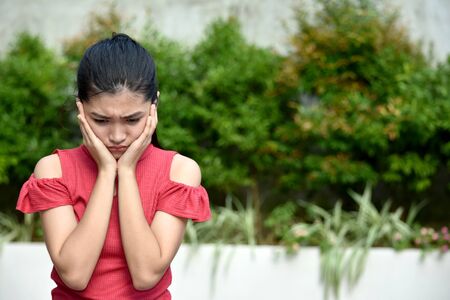 A Youthful Minority Girl And Sadnessの写真素材