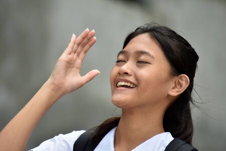 A Laughing Cute Filipina School Girlの写真素材