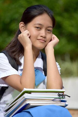 Unhappy Youthful Minority Teen Student School Girlの写真素材