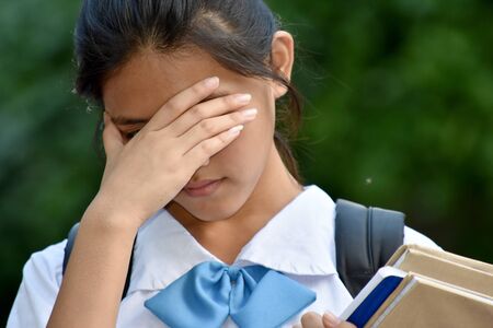 A Sad Cute Minority Girl Studentの写真素材