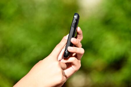 A Hand Holding Smartphoneの写真素材