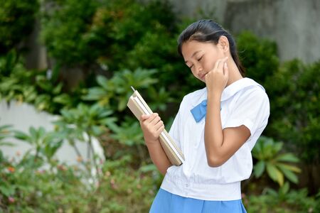 Beautiful Girl Student And Shyness With School Books