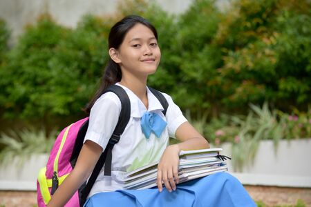 A Pretty Filipina Female Student Sittingの写真素材