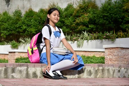 A Young Diverse Girl Student Sittingの写真素材