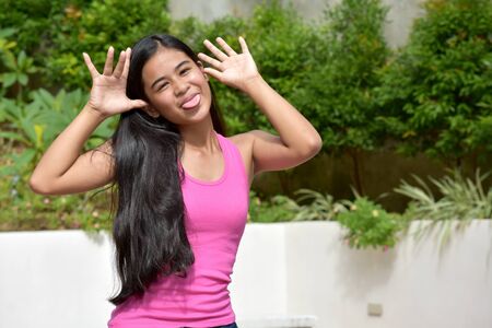 Youthful Filipina Girl Making Funny Facesの写真素材