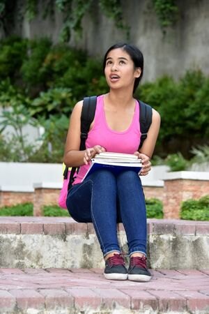 A Beautiful Diverse Student Teenager Sittingの写真素材