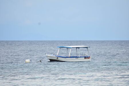 A Boat Floating In Ocean Water