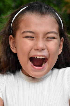A Youthful Philippina Female Laughing Closeupの写真素材