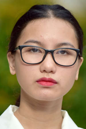 Serious Filipina Adult Female With Glassesの写真素材