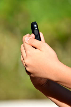 A Hand Holding Mobile Phoneの写真素材