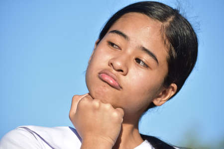 A Bored Asian Female Teenager Isolated
