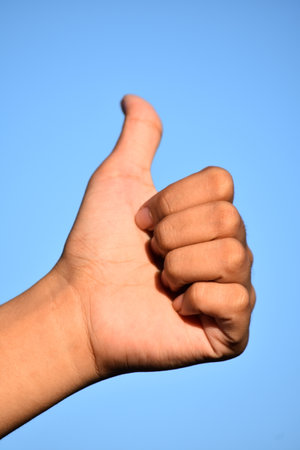 A Female Hand Thumbs Upの写真素材