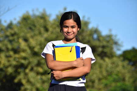 Beautiful Asian School Girl Posing Wearing School Uniform Holding Textbooks