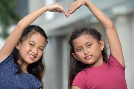 A Friends Making Loving Heart Shapeの写真素材