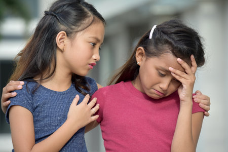 Asian Girl Has Compassion For Sad Friendの写真素材