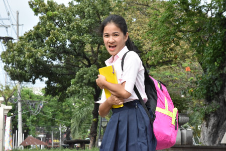 Female Student And Laughter Wearing Backpack With Textbooks
