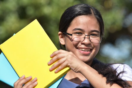 Smiling Pretty Female Student Wearing Glassesの写真素材