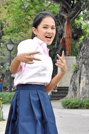 Fun Pretty Minority Female Wearing Pink Shirt In Public Park