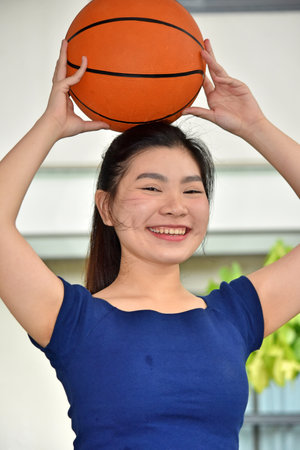 Smiling Fit Chinese Female Basketball Playerの写真素材