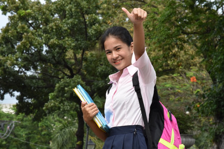 A Girl Student With Thumbs Upの写真素材