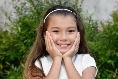 An Adorable Youthful Filipina Female Outdoorsの写真素材