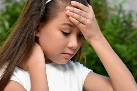 Sick Young Filipina Female Child Outsideの写真素材
