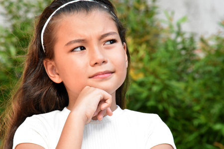 Youthful Philippina Female Making A Decision Outsideの写真素材