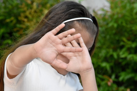 A Young Philippina Child Afraid Outdoorsの写真素材
