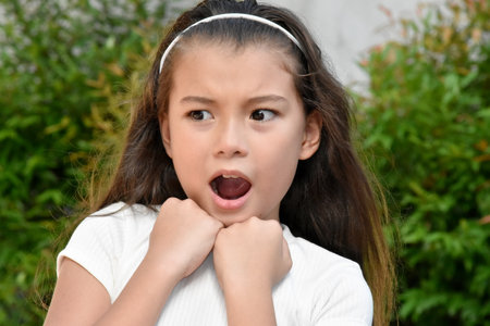 A Fearful Pretty Philippina Girl Outsideの写真素材