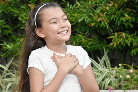 An Appreciative Diverse Female Kid Outdoorsの写真素材