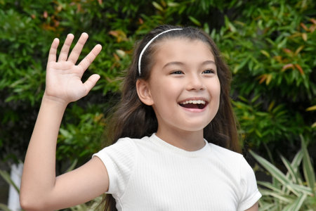 Youthful Asian Girl And Laughter Outdoorsの写真素材
