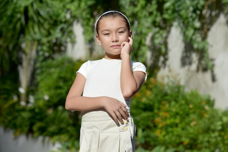 A Thoughtful Young Asian Person Outdoorsの写真素材