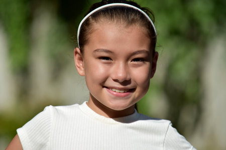 A Smiling Cute Diverse Girl Outsideの写真素材